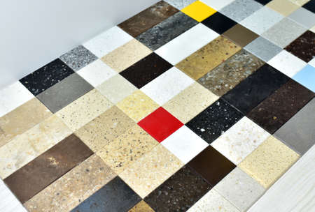 Samples of acrylic artificial stone for countertops. Artificial stone for interior decoration in the...