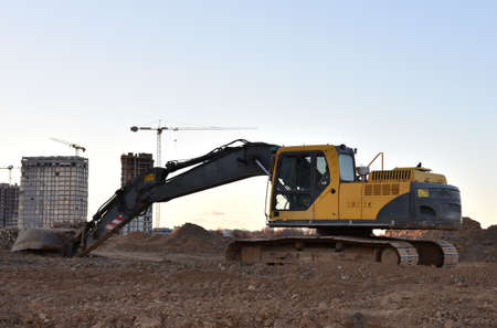 Excavator on earthworks at construction site. Heavy machinery and equipment for earthmoving