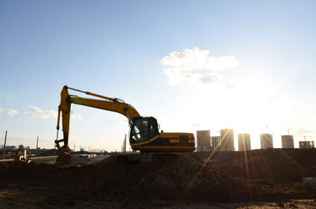 Excavator on earthworks at construction site. Heavy machinery and equipment for earthmoving