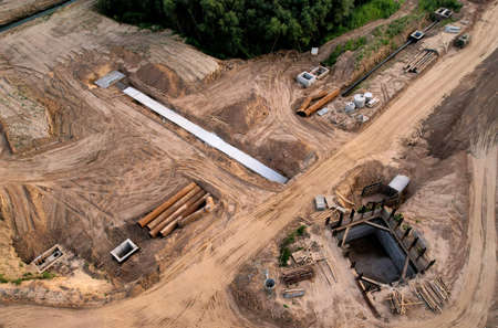 Construction of stormwater pits and sanitary sewer system. Laying of underground storm sewer pipes...