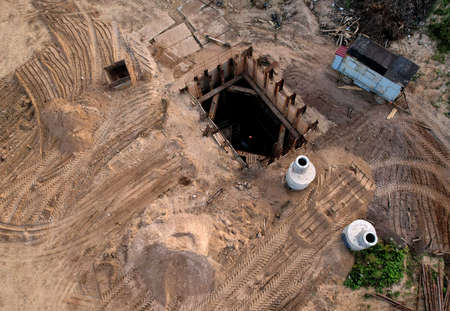 Construction of stormwater pits and sanitary sewer system. Laying of underground storm sewer pipes...