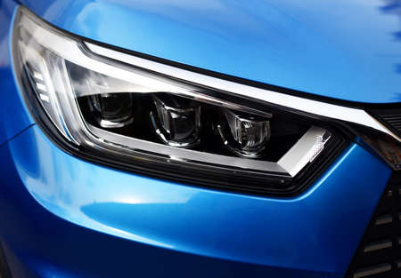 Headlight. LED headlamp of a modern car. Frontal lighting of highway vehicles with daytime running...