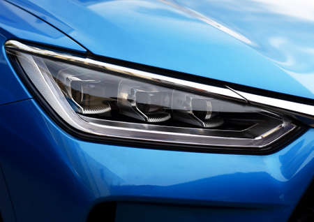 Headlight. LED headlamp of a modern car. Frontal lighting of highway vehicles with daytime running...