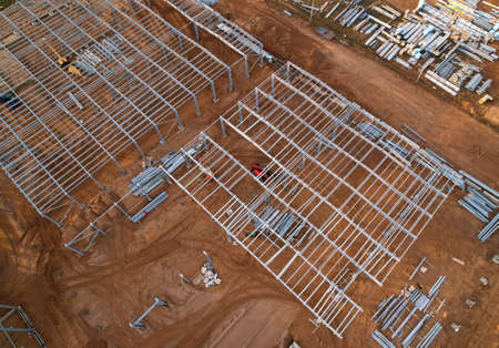 Warehouse Construction from metal structure. Industrial building on light gauge steel framing. Frame...
