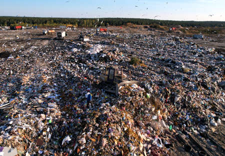 Garbage dump with waste plastic, polyethylene and food waste. Trash disposal for recycling and...