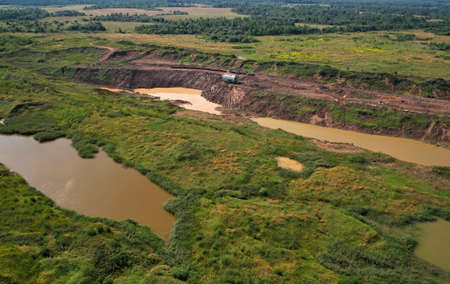Dragline excavator works in an open pit for the extraction of clay. Largest Walking Dragline...