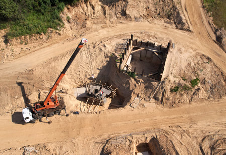 Ð¡onstruction of storm sewer collector. Truck crane during the pouring of the formwork. Drainage...