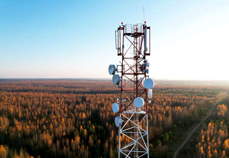 Mobile Tower installation. Cell site and Telecom Base Station. 5G internet online generation. Health Hazards Caused By Mobile Tower Radiation. Telecommunications and Wireless network. Wifi antenna.の写真素材