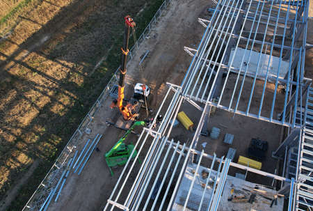 Warehouse Construction from metal structure. Industrial building on light gauge steel framing. Frame...