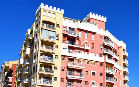 Facade building in colorfull. Residential building with balconies and windows. colorful apartment house. house window and balcony. Modern Buildings minimalist architecture. home facade.の写真素材