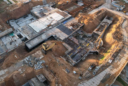 Construction site with tower cranes on construction. Foundation slab for monolithic reinforced....