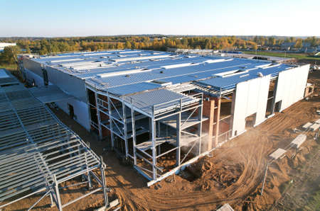 Warehouse Construction from metal structure. Industrial building on light gauge steel framing. Frame...