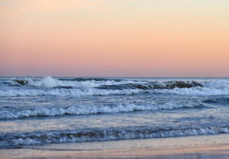 Waves at sea on dramatic sunset background. Waves at sea during storm and wind. Wave from the sea...