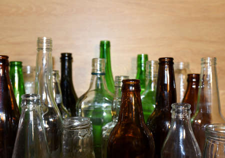 Glass waste for recycling. Empty glass bottles from beer wine and champagne. Ecology and environment...