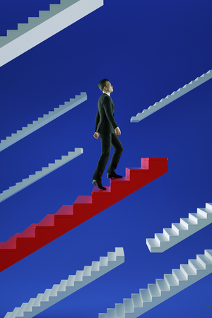 Go to success. Businessman climbs a red flying stairs.の写真素材