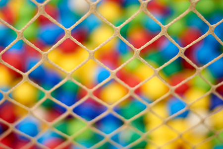 Net or Rope and Colourful balls blur background in the kids playground.の写真素材
