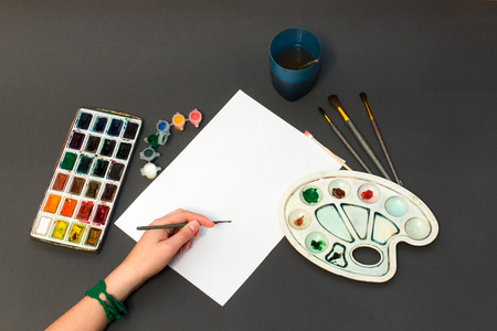 Drawing set for paint and hand with brushの写真素材