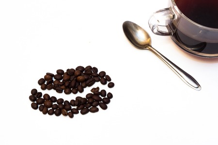 cup of black coffee with roasted coffee beans on white backgroundの写真素材