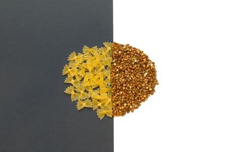 Buckwheat is sprinkled / premium buckwheat groats on white backgroundの写真素材