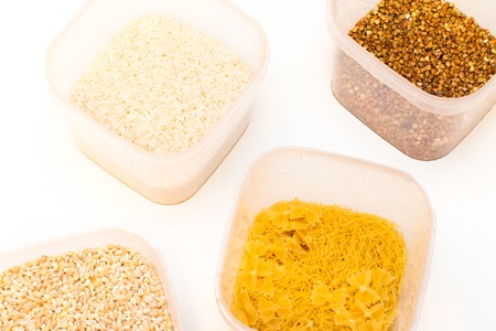 Buckwheat is sprinkled / premium buckwheat groats on white backgroundの写真素材
