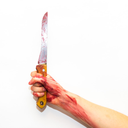 female hand with bloody steel knife with a wooden handle on a white background to the topic of...