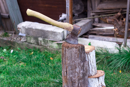 Axe hammer to block in the village in summerの写真素材
