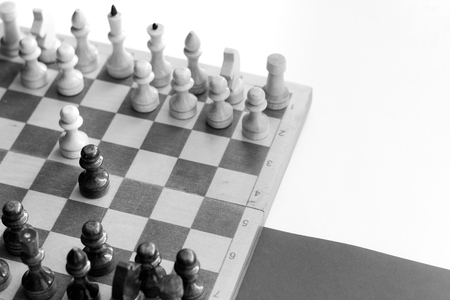 black white checkerboard with figures on black white backgroundの写真素材
