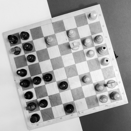 black white checkerboard with figures on black white backgroundの写真素材