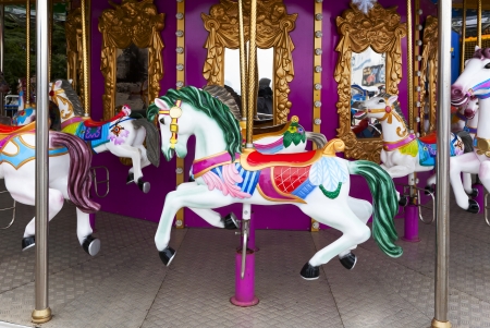 Carousel Horses on carnival Merry Go Roundの写真素材