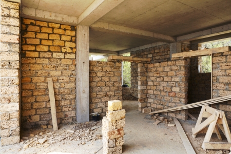 building house of concrete frame with walls from shell rockの写真素材