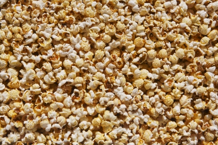 microwave popcorn behind the glass natural food backgroundの写真素材