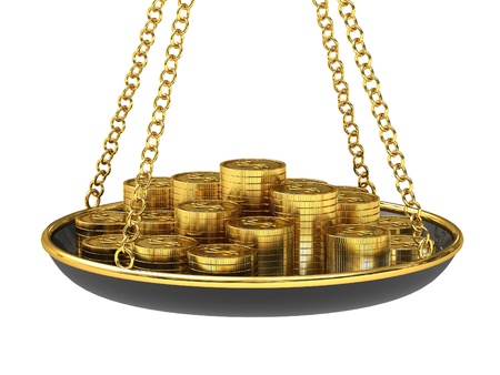 Gold coins on the scalesの写真素材