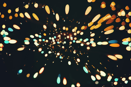 Festive Christmas background. Elegant abstract background with bokeh defocused lights and starsの写真素材