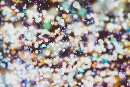 Festive Christmas background. Elegant abstract background with bokeh defocused lights and starsの写真素材