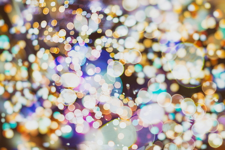 Festive Christmas background. Elegant abstract background with bokeh defocused lights and starsの写真素材