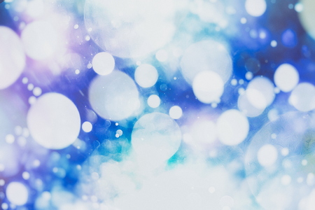 Festive Christmas background. Elegant abstract background with bokeh defocused lights and stars