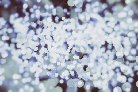 Festive Christmas background. Elegant abstract background with bokeh defocused lights and starsの写真素材