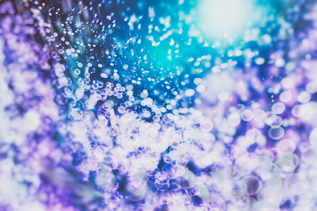 Festive Christmas background. Elegant abstract background with bokeh defocused lights and starsの写真素材