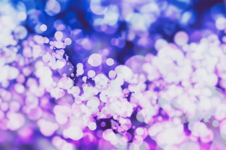 Festive Christmas background. Elegant abstract background with bokeh defocused lights and starsの写真素材