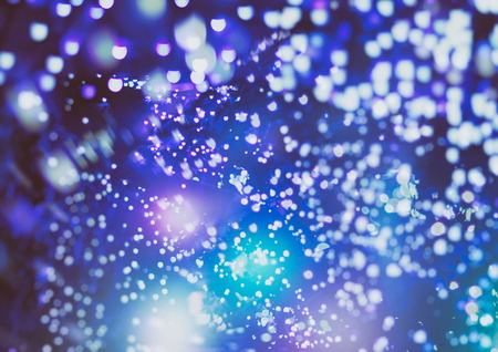 Festive Christmas background. Elegant abstract background with bokeh defocused lights and stars
