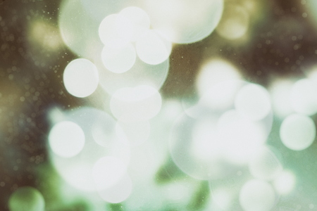 Festive Christmas background. Elegant abstract background with bokeh defocused lights and stars