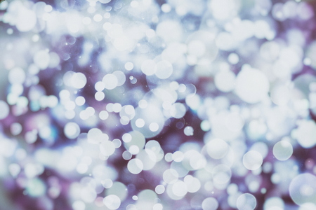 Festive Christmas background. Elegant abstract background with bokeh defocused lights and starsの写真素材