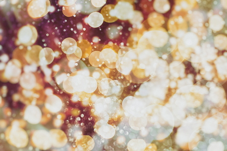 Festive Christmas background. Elegant abstract background with bokeh defocused lights and starsの写真素材