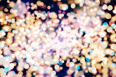 Festive Christmas background. Elegant abstract background with bokeh defocused lights and starsの写真素材