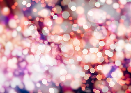 Abstract Festive background. Glitter vintage lights background with lights defocused. Christmas and New Year feast bokeh background with copyspace.の写真素材