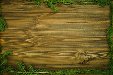 Decorated pine branches  on wooden table free spaceの写真素材