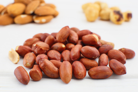 Nuts and dried fruits on wooden backgroundの写真素材