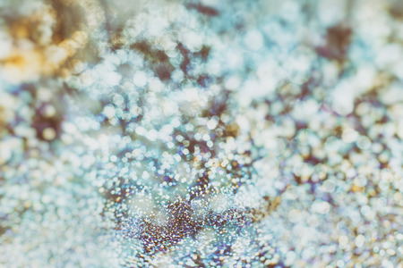 Festive background. Glitter vintage lights background . Christmas and New Year feast backgroundの写真素材