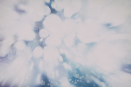 Festive Christmas background. Elegant abstract background with bokeh defocused lights and starsの写真素材