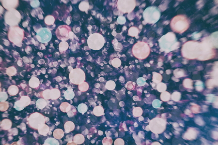 Festive Christmas background. Elegant abstract background with bokeh defocused lights and starsの写真素材